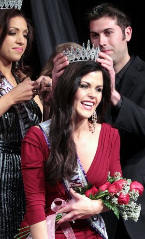 contributed photo Kimberly Stommes registers delight as she is crowned Mrs. Minnesota during a pageant at St. Cloud State University. She will go on to compete for the title of Mrs. International in July in Jacksonville. Fla. 