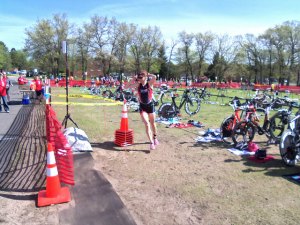 photo by Dennis Dalman After dropping off her bike, a duathlete hurries from the Apple Duathlon transition area to run the last lap of the race. 