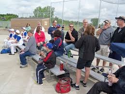 photo by Dennis Dalman Parents and players chat in the bleachers during a tournament at Pinecone Central Park in the summer of 2013. The tourney took place during a grand opening of the park’s multiplex baseball fields. During the Friday, May 30 grand opening, the public will have a chance to see and/or experience even more amenities at the park. 