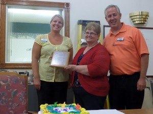 contributed photo Heidi Hagen (left) and Chris Buley (right) from Heartland Hospice with Karen Hennessy, housing manager from Arlington Place.