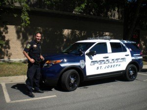 photo by Janelle Von Pinnon Officer Shane Vernier shows off the St. Joseph Police Department's newest squad unit, a 2014 Ford sport-utility vehicle.