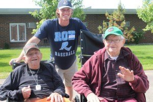 contributed photo Country Manor residents Ed Opatz (left) and Earl Corrigan with St. Cloud Rox baseball player Kevin Burgee. The thrill of baseball filled the air on June 17 when players and staff from the St. Cloud Rox baseball association came to take part in the annual “Rox Baseball Block Party” at Country Manor Campus. Residents represented the sport well, dressed in baseball attire and caps and big-brimmed summer hats. Enthusiastic residents were treated to an array of baseball-themed games and even a special autograph session to commemorate America’s favorite pasttime and the beautiful summer day. The St. Cloud Rox visit allowed residents an opportunity to get to personally know the players they rooted for from the stands during the St. Cloud Rox Veterans' Appreciation Night Game held July 20 in which residents who served our country were recognized, appreciated and honored throughout the game.