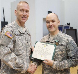 contributed photo Col. Timothy Holtan, commander and conductor of the U.S. Army Field Band presents Master Sgt. Michael Klima, musician, the Army Commendation Medal Aug. 12 during a ceremony at Fort George G. Meade, Md.