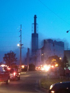 photo by Tara Wiese The spectral glow of lights a haze of smoke dominate the scene at the Verso paper mill in Sartell after a fire broke out at the demolition site at 8 p.m. Aug. 6. It took firefighters from five departments five hours to put out the flames. Two Sartell firefighters suffered minor injuries.