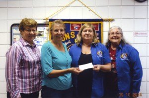 contributed photo Kathi Schmidt, (second from right) president of the St. Joseph Y2K Lions, along with Y2K Lions members Ginger Meier (left) and Kay Lemke (right), present Jan Boecker with a $1,300 check for Chad's Memorial Wing at the Place of Hope in memory of Chad Boecker, son of Ralph and Jan Boecker. Chad's Memorial Wing is the third floor of the Place of Hope's residential center and will be used to assure those struggling with overwhelming life problems have a safe, secure and inviting place to rebuild, repair and restore their lives.
