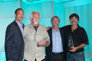 contributed photo From left to right, Rob Parmentier, president and CEO of Larson Boats, presents awards to Dick Peifer and Roger O'Hotto (holding awards) while Pat Blake, vice president of Larson's, looks on.