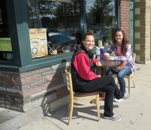 photo by Cori Hilsgen Maria Kiminski (left) and Amy Kiminski enjoyed a sisterly chat in front of the Local Blend Sept. 13. Maria Kiminski is a sophomore at the College of St. Benedict studying elementary education. Amy Kiminski graduated from CSB last year and was visiting for the weekend. The two are from Farmington and planned to attend a soccer game that afternoon. Maria Kiminski said St. Joseph is a great place and it is moments like their time spent together that make it special.  