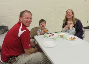 photo by Cori Hilsgen Austin Hoffmann, , and Adam Hoffmann, 2, enjoy pizza and apples with their parents Peter and Jill Hoffmann. Austin attends the ECFE program at Colts Academy. His grandparents, Bonnie and Mark Gohmann, are long-time St. Joseph residents.  