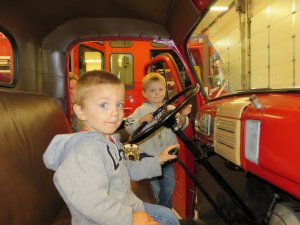 photo by Cori Hilsgen Rick and Melanie Klisch's two-year old twin sons, Gavin and Grant, enjoy checking out the inside of the "old" fire truck. 