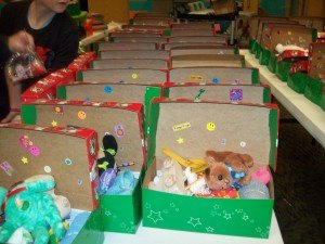 contributed photo Shoe boxes filled with happy surprises are lined up at Celebration Lutheran Church, waiting to be delivered for their long journeys overseas.