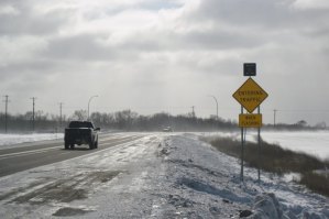 photo by Logan Gruber The new warning system indicates whether traffic is entering Highway 2 from Minnesota Street, and is visible for both north- and south-bound vehicles. 