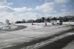 photo by Logan Gruber A van turns onto Highway 2 from Minnesota Street after a truck passes and the warning system stops flashing.