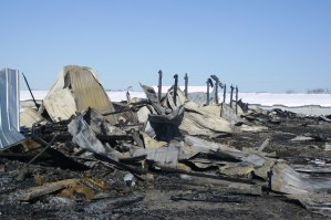 photo by Logan Gruber The smell of smoke still filled the air a day after fire destroyed a turkey barn north of St. Joseph.