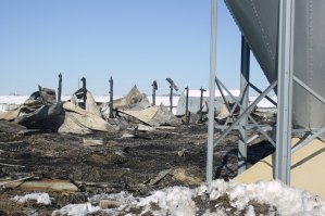 photo by Logan Gruber The smell of smoke still filled the air a day after fire destroyed a turkey barn north of St. Joseph.