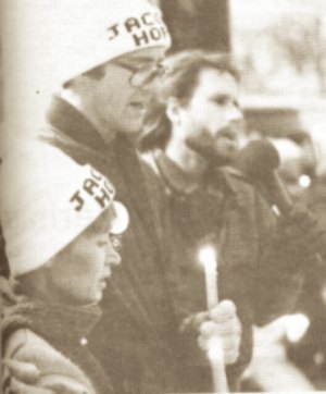 photo by Stuart Goldschen Patty and Jerry Wetterling join Dough Wood of Sartell, author of the song, "Jacob's Hope," at a candle and song rally at Lake George, Nov. 18.