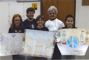 contributed photo All Saints Academy Peace Poster Contest winners include the following (left to right): Josie Meyer, third place; Reese Moneypenny, first place; and, Claire Siasu, second place; (back row) Ann Reischle and Delrose Fischer, St. Joseph Y2K Lions. Moneypenny's poster was selected for its originality, artistic merit and portrayal of the contest theme, "Peace, Love and Understanding." His poster has been sent to face competition at the district level. 