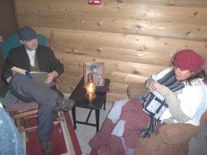 photo by Dennis Dalman The parents of Tiny Tim Cratchit, a poor and crippled boy, sit in their home and discuss, among other things, the mean-spirited and stingy boss named Ebenezer Scrooge. 