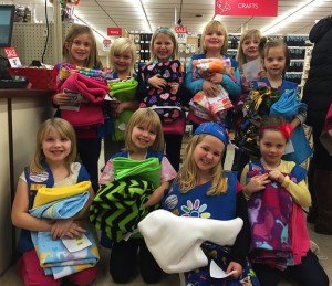 contributed photo Girl Scout Daisy Troop #106 met at Hancock Fabrics on Dec. 11 to pick out fleece to donate to the the St. Cloud Hospital's Neonatal Intensive Care Unit Family Support program. The girls used a portion of last winter's cookie sales to buy the fabric. The fabric is then used by parents to make "Tummy Time" blankets at the baby's bedside in the NICU, which the parents then take home once the baby is ready to leave. Most of the troop is from Sartell. (Front row) Emma Pickett, Elka Sowada, Mckenzie Steiner and Lauren Pederson; (back row) Lucy Conda, Katelyn Noble, Emma Johnson, Amelia Bjerke, Caitlyn Hollenkamp and Chloe Wolford.