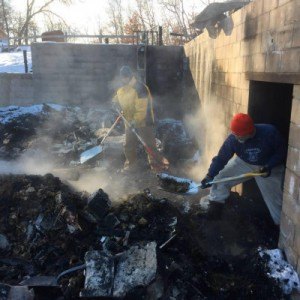 contributed photo Shovels were welcome to help clean after the barn burned down, but skid loaders and backhoes were needed to finish the job, Todd Theisen said.