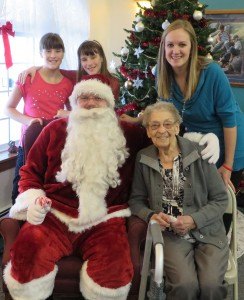 photo by Cori Hilsgen Some of resident Lenora Hilsgen's grandchildren posed with her and Santa at the party. Pictured are (first row, left to right) Santa and Hilsgen and (second row, left to right) twins Amber and Allie Hilsgen, 10, and Melanie Hilsgen. 
