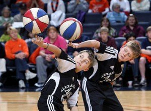 contributed photo Masters of spin, two boys – members of the Alexandria Aces – wow a crowd during a half-time exhibition show. The Aces were the hosts of a vast spin-a-thon to make the Guinness Book of World Records, a feat in which three Sartell boys participated. 