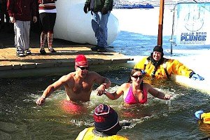 contributed photo A split second after the plunge, MaryBeth Munden and Rick Welch are instantly eager to get out of the frigid lake and into the warmth of a nearby tent. 