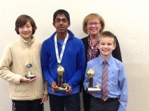 contributed photo Sartell Middle School seventh-grader Janagan Ramanathan (middle) recently won the schoolwide Geography Bee. Mathew Bolton (right) took second place and Luc Westling took third place. Shown with the boys is Sartell Middle School Principal Julie Tripp. Ramanathan, whose older brother Gopi also won many geography bees, now has a chance to take a qualifying test for the chance to advance to state competition April 5. The state winners then go to the National Geography Bee in Washington, D.C., where they have a chance to win a $25,000 scholarship. 