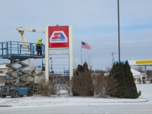 photo by Logan Gruber Contractors replaced the BP sign at the corner of Pinecone Road and 2nd Avenue S. on Tuesday, as JM Companies changes some stations over to SuperAmerica.