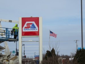 photo by Logan Gruber Contractors replaced the BP sign at the corner of Pinecone Road and 2nd Avenue S. on Tuesday, as JM Companies changes some stations over to SuperAmerica.