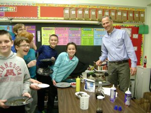contributed photos All Saints Academy president Chris Schellinger recently served fifth-grade students breakfast as their reward for collecting the most Workathon donations. The students were hungry and ate all of the waffle batter and toppings served by Schellinger. Pictured (left to right) are Grant Wensmann, Reese Moneypenny, Max Meyer, Daniel Moog, John Hawkins, Claire Sia Su and Schellinger. 