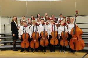 contributed photo The Kennedy Community School sixth-grade orchestra is pictured with director of orchestras Kimberly Fahy. 