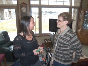 photo by Dennis Dalman Clara Wesley (right), one of the residents of the Waterford Apartments, chats with Katy Sabinsky, the coordinator for the complex. Wesley agreed to open her large two-bedroom apartment to a recent tour of the Waterford by members of the Sartell Senior Connection.