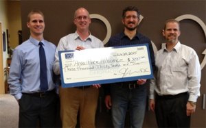 contributed photo (From left to right) Drs. Marc Anderson, Brent Venables and Jon Anderson from 360 Chiropractic in Sartell present a check for $3,037 to (second from right) Charles Hempeck, executive director of Anna Marie’s Alliance, after their Patient Appreciation Week fundraiser held Jan. 12-16.