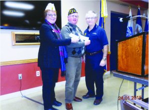 contributed photo Commander of the Minnesota Department of the American Legion Peggy Moon, and her husband Dr. Carl Moon, Commander of the American Legion Minnesota 6th District, both of St. Joseph, hold $200 checks for the Legionville project, presented by Post 328 Commander Chuck Kern.