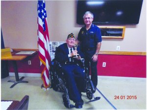 contributed photo Legionnaire Larry Tillemans holds his Emmy, beside Post 328 Commander Chuck Kern.