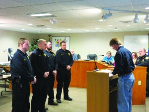 photo by Logan Gruber Mayor Schultz swore the new reserve officers into service during the Feb. 2 city council meeting. 
