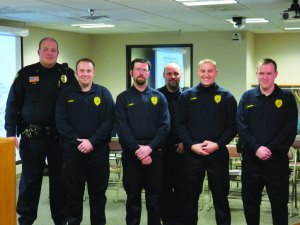 photo by Logan Gruber Pictured from left to right are: Chief Joel Klein of St. Joseph, Reserve Officers Shane Johnson of St. Joseph and Gary Lauer of St. Joseph, Officer ________ ?, and Reserve Officers Brent Fandel of St. Cloud and Nate Honkomp of Avon.