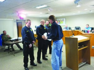 photo by Logan Gruber Mayor Schultz congratulated the new reserve officers after swearing them in during the city council meeting on Feb. 2.