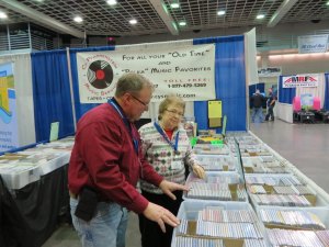 photo by Cori Hilsgen Cy Pfannenstein (left) and his mother Ginny worked the Cy Pfannenstein Music Service booth at the Farm Show.  