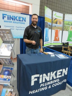 photo by Cori Hilsgen Aaron Rieland discussed water solutions at the Finken Companies booth. 