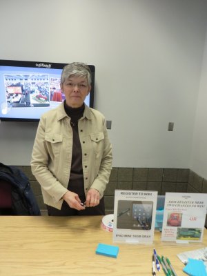 photo by Cori Hilsgen Farm show organizer Ginny Kroll discussed the event at a registration table.  