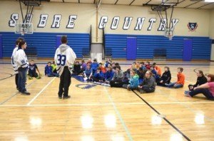 contributed photo Four members of the Fellowship of Christian Athletes from Sartell High School give a pep talk and inspirational message at Sartell Middle School. The middle school also has a chapter of Fellowship of Christian Athletes, who attended the meeting with the high-school visitors. 