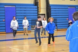 contributed photo Students at Sartell Middle School take part in physical activity during a meeting with their high-school peers – four members of the Fellowship of Christian Athletes. In the background are four of the FCA members – Carter Kasianov, Keenan Lund and JJ Lund. 