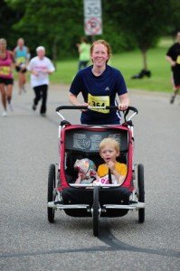 contributed photo Tami Huberty of Sartell enjoys a run with two of her three children – Callum and Ada. Huberty is about to launch a running program for women called Moms on the Run. It is a way for women to meet, socialize, get in shape and have fun while running 5k courses.  
