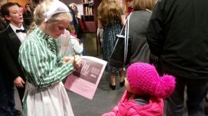 photo by Nancy Campbell Kylah Corcoran, left, a 7th grader from Sartell Middle School, signed the program of a pint-sized fan last weekend after a performance of the musical "Annie Jr." at the high school auditorium. Corcoran was part of the chorus in the musical.