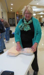 photo by Cori Hilsgen Church of St. Joseph Health and Wellness Minister Marjorie Henkemeyer practices on a manikin during a Bystander CPR class. 