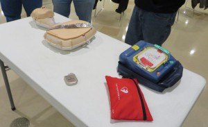 photo by Cori Hilsgen Some of the items Hengel and Kempenich brought to class included (left to right) manikins, a Medtronic pacemaker/defibrillator and an AED. 