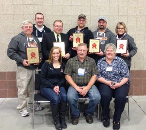 contributed photo St. Joseph Meat Market employees and owners Harvey and Carol Pfannenstein hold the awards they received at the 75th annual convention of the Minnesota Association of Meat Processors. Shown are (front row, left to right) Wendy Theisen, Harvey and Carol Pfannenstein; (back row) Rich, Dan and Cy Pfannenstein, Jesse Stueve, Roger Rudnicki and Alice Mayers. 