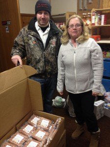 contributed photo Dan Pfannenstein drops off four boxes of meat product, made in the St. Joseph Meat Market sausage kitchen during the MAMP pre-convention, to St. Joseph Food Shelf coordinator Ann Scherer. 