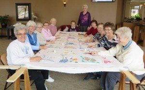 photo by Cori Hilsgen Area quilters from the Church of St. Joseph recently stitched on a butterfly hanky quilt for the annual parish bazaar July 3 and 4. Shown (left to right) are Delrose Fischer, Marilyn Brinkman, Ellie Studer, Betty Schloemer, Josie Meyer, Irene Symanietz, Judy Meemken, Ilene Schmitt, Ione Jacobs, Barb Heltemes and Geri Schwab. Missing quilters include Ida Johnson, Winnie Pfannenstein, Delores Lowell and Maryanne Poepping. 